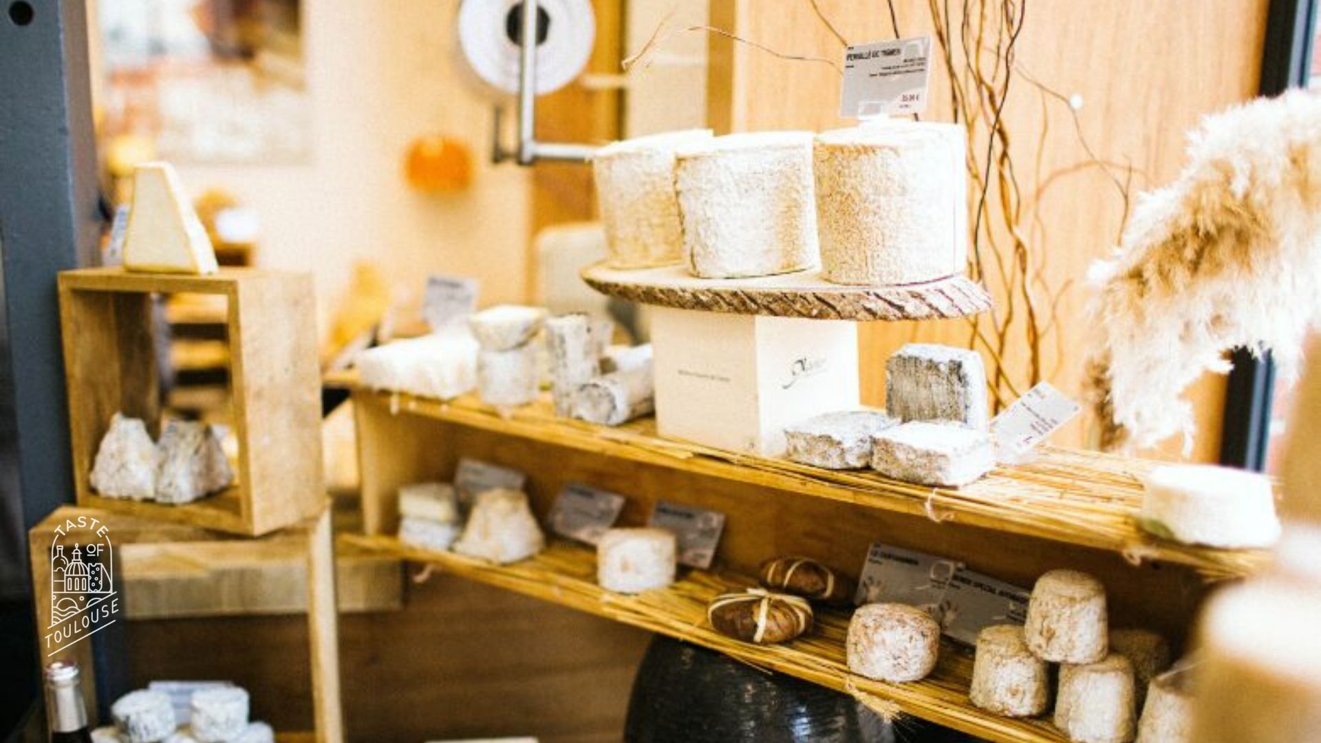 Artisan cheeses at Xavier Fromagerie. Taste of Toulouse Zoom virtual background.