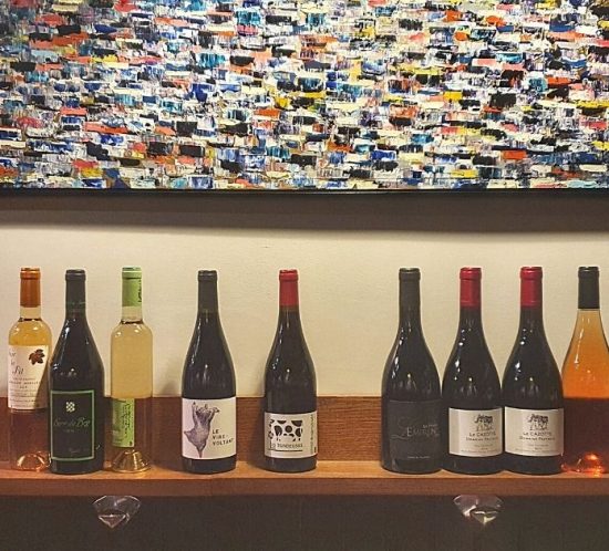 Wall of wine bottles at Bacaro wine bar in Toulouse
