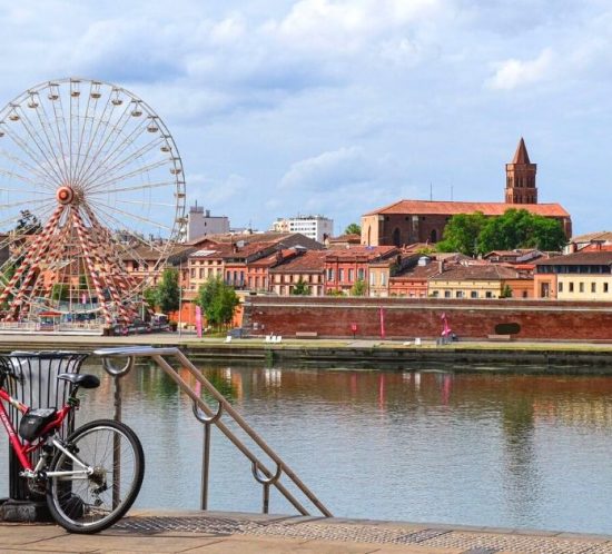 Ferris wheel beside the river in Toulouse