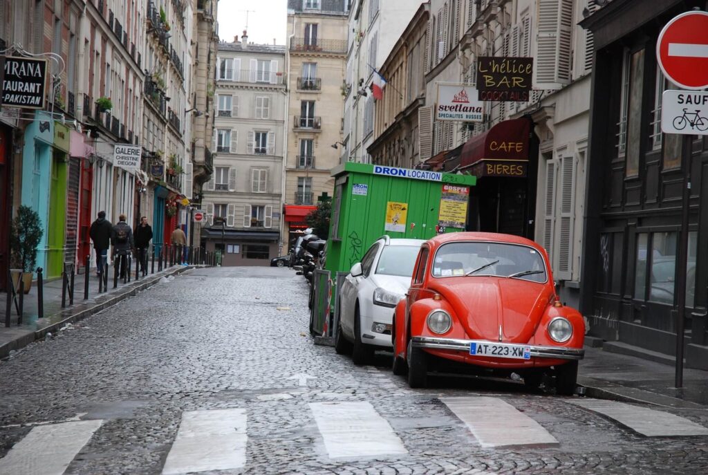 Paris street with red and white cars