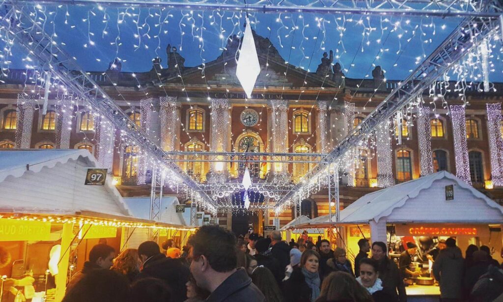People enjoying Toulouse square in Christmas